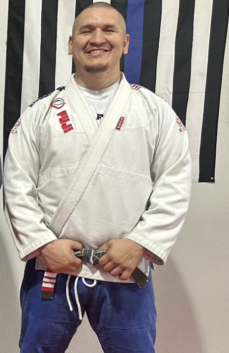 Professor Adrian Quintanilla wearing his Brazilian Jiu Jitsu gi and black belt